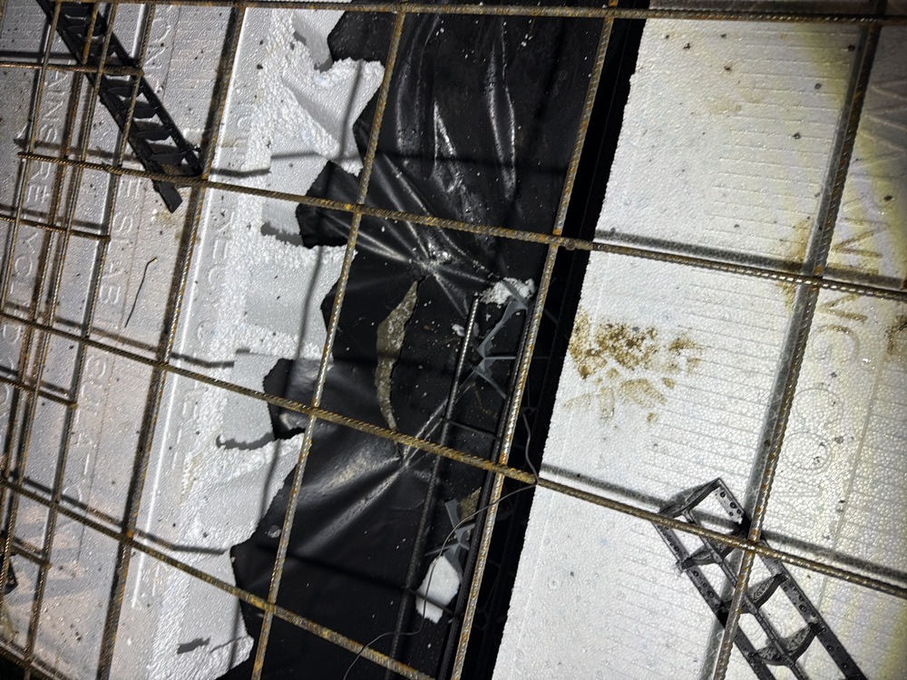 Damaged vapour barrier before a pour, Pakenham East