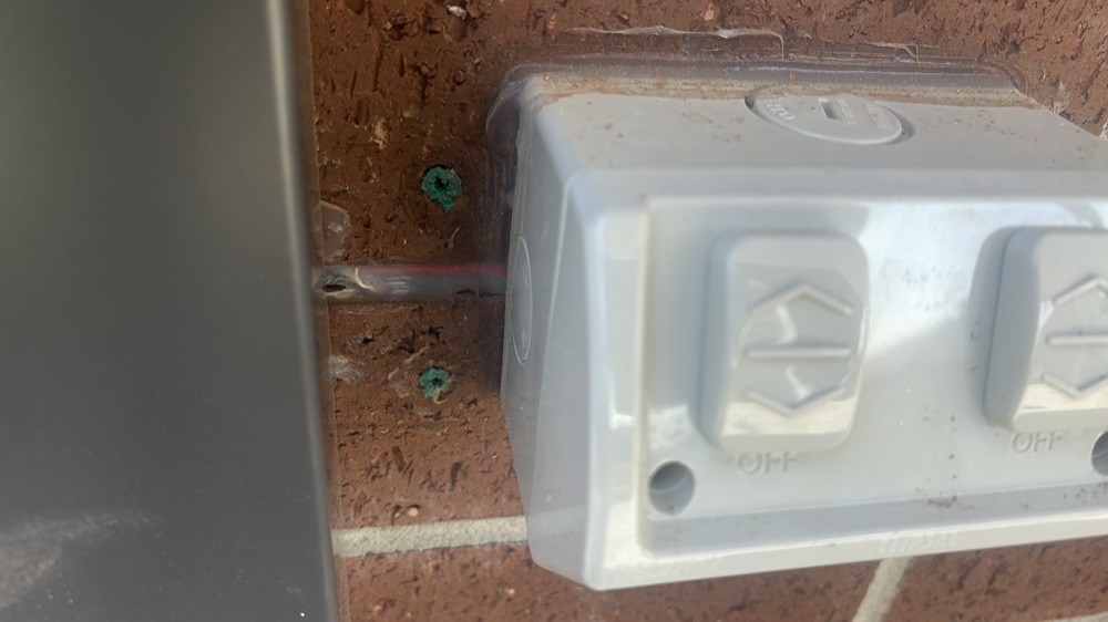 Non-compliant external power point wiring, recorded on a pre-handover inspection in Nar Nar Goon, 5 km from Pakenham East