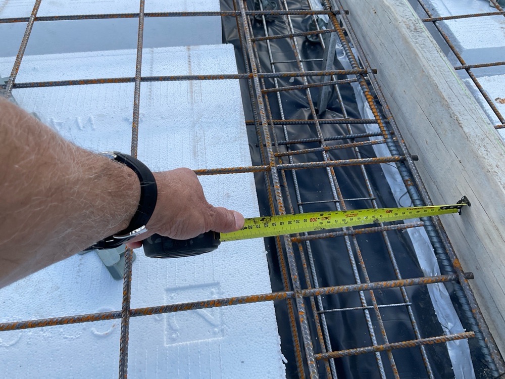 Reinforcement extension under 300 mm at a footing step, recorded on a slab pre-pour inspection in Officer, 10 km from Pakenham East